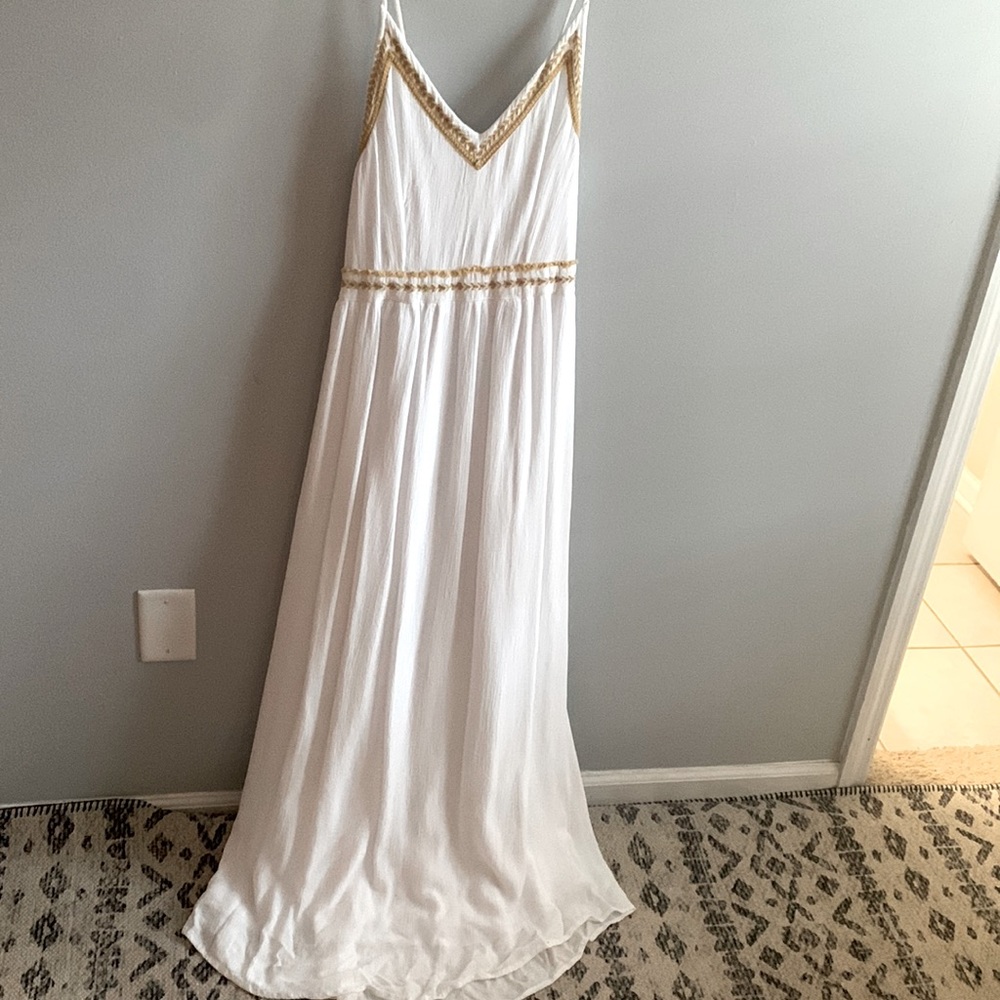 White maxi dress with gold trim details